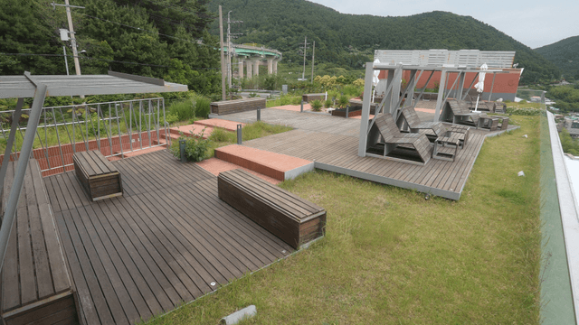 Rooftop garden with wooden benches