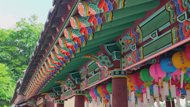 Eaves of traditional Korean temple with various lanterns