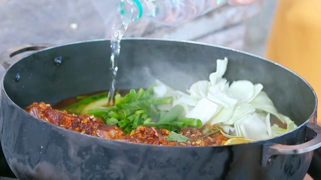 Vegetables and meat simmering in a pot