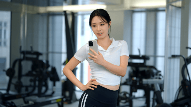Young woman taking a selfie at the gym