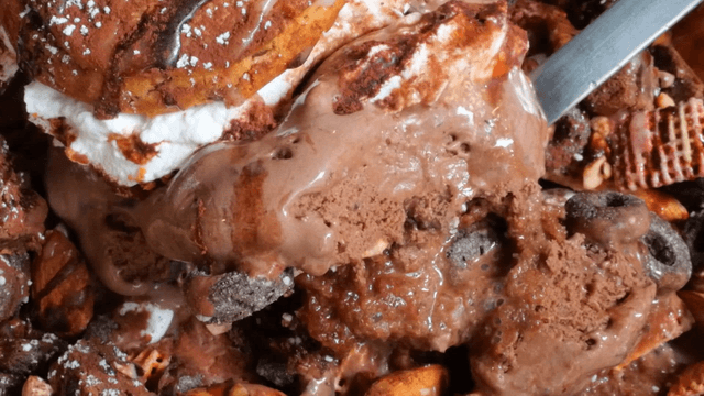 A spoonful of chocolate shaved ice with chocolate ice cream