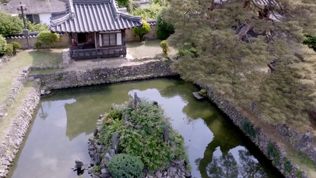 Traditional Korean house with a pond