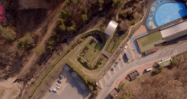 Aerial view of a park and parking lot