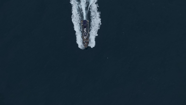 A ship sailing through the open sea