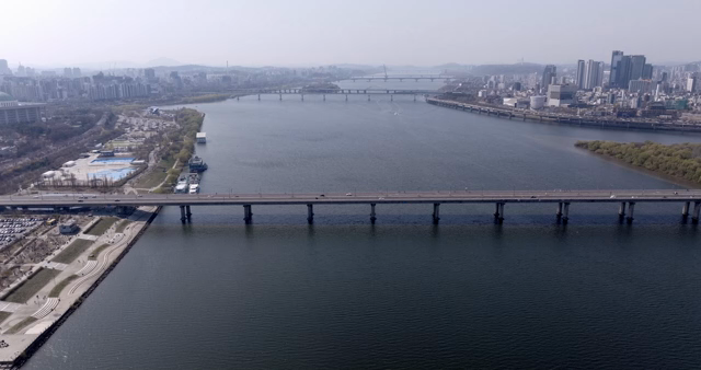Aerial view of a river and city skyline