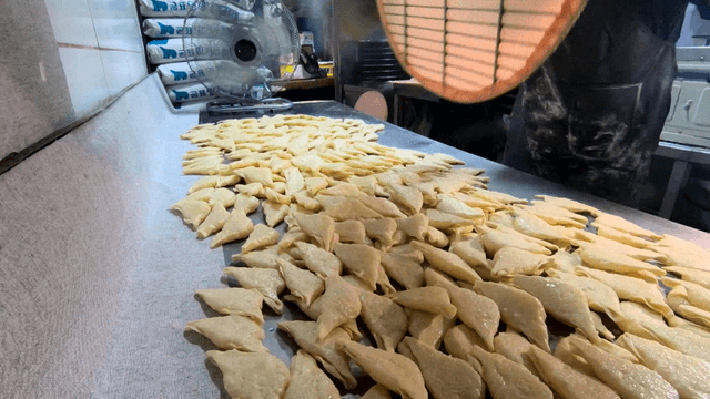Dumplings stacked on the kitchen counter