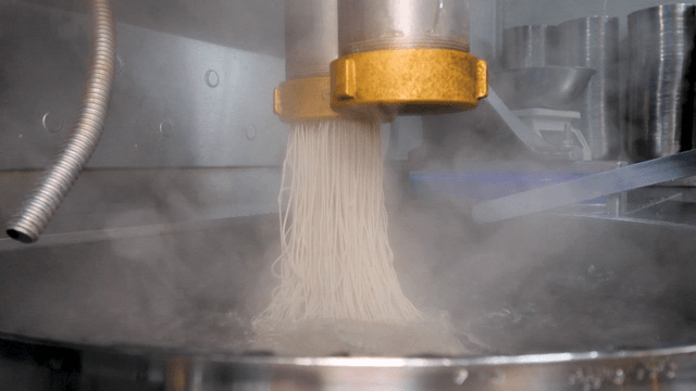 Buckwheat noodles extruded into boiling water