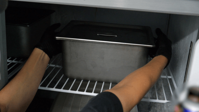 Placing a metal container in a freezer