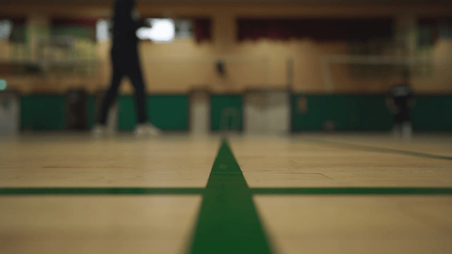 Indoor badminton game in a gym