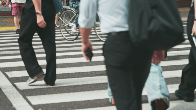 People crossing a busy city street
