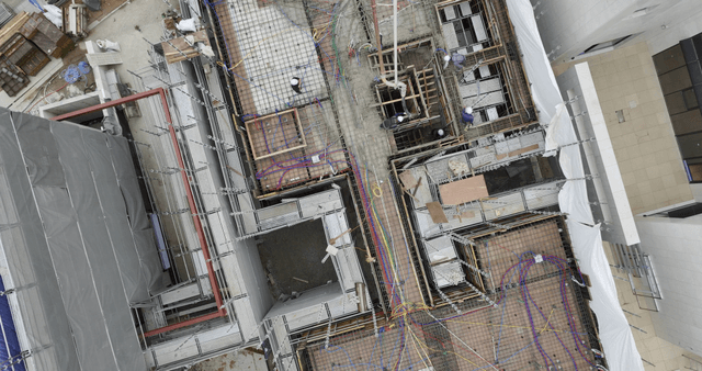 Construction workers pouring concrete