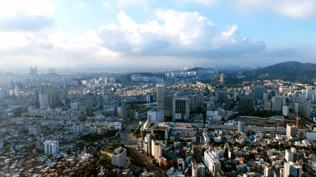 Sprawling cityscape under a blue sky