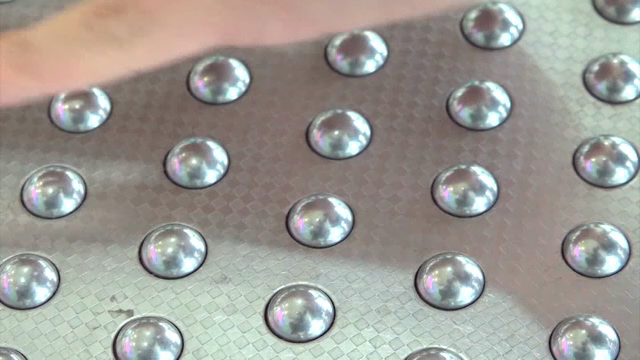Hand touching the dust suction mat