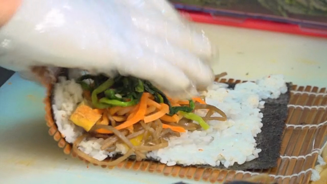 Preparing gimbap with fresh vegetables