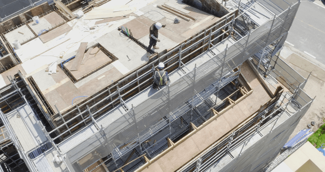 Construction site with workers and materials