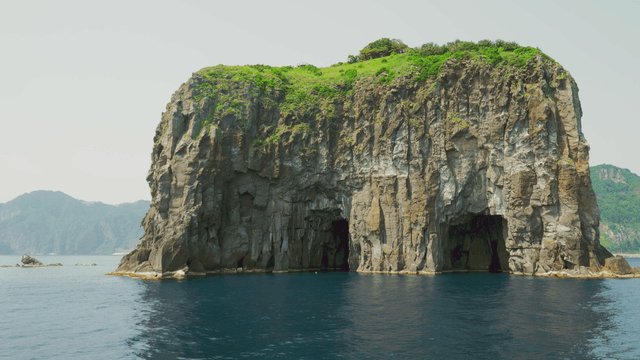 Majestic cliff by the sea with clear water