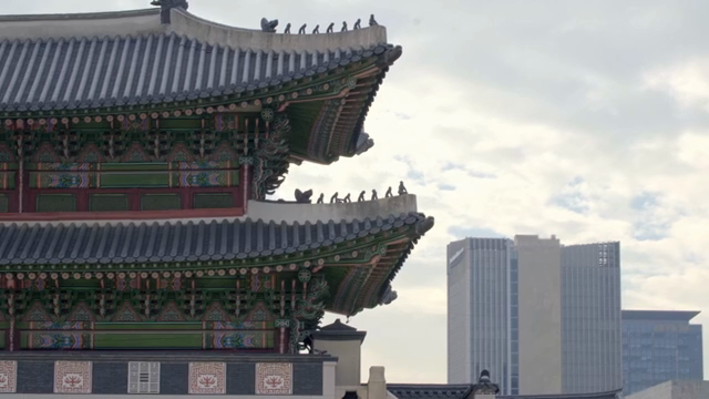 Traditional Korean palace with modern buildings