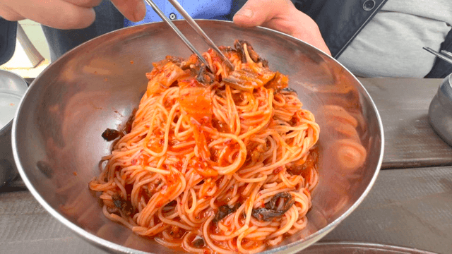 Spicy Korean bibim noodles with young radish kimchi
