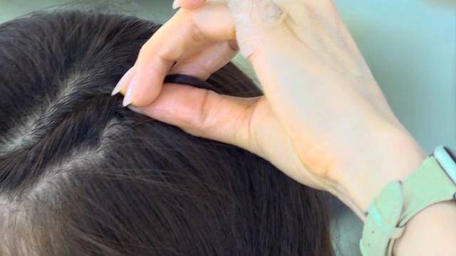 Hair being styled with precision