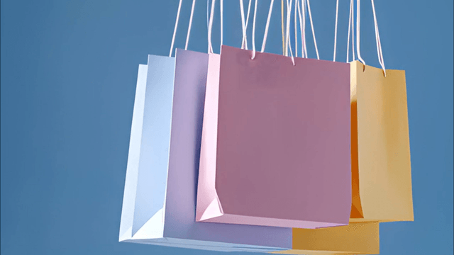 Colorful shopping bags hanging on strings
