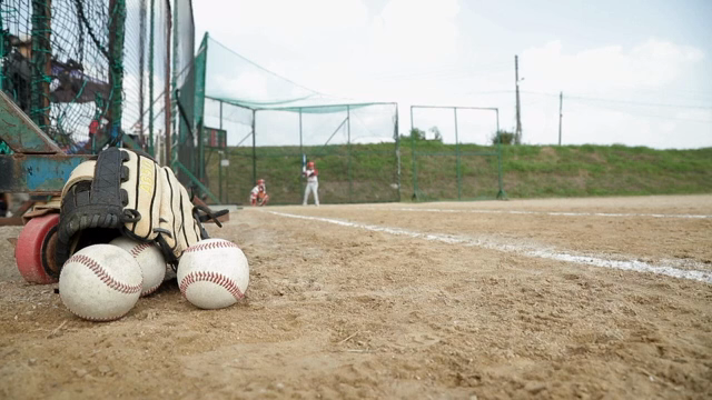 Baseball field with equipment and players