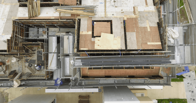 Construction site with workers and materials