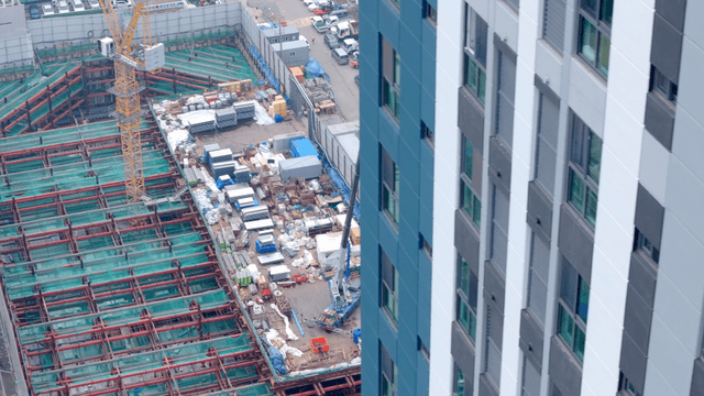 Construction site with cranes and buildings