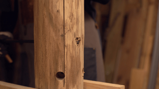 Woodworking with a drill in a workshop