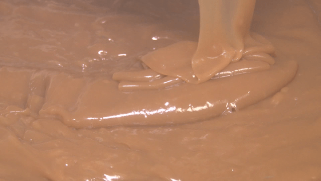 Brown sauce dripping from a spatula