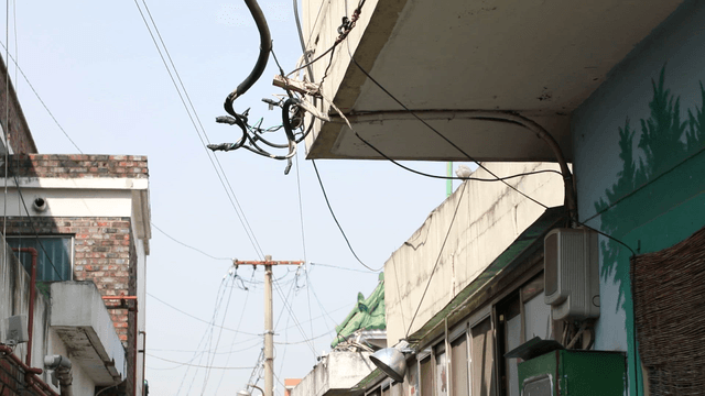 Alley with power lines and buildings