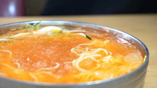 Cold Buckwheat Noodles in icy broth being served
