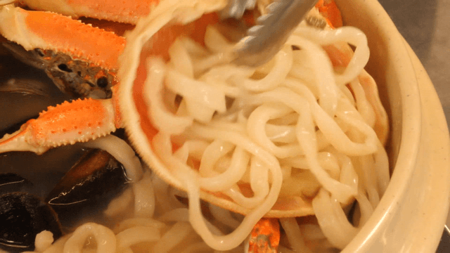 Crab and seafood in a noodle soup
