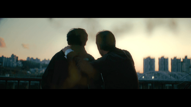 Two friends watching the sunset