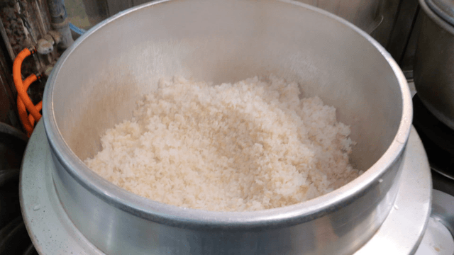 Steaming barley rice in large cooker