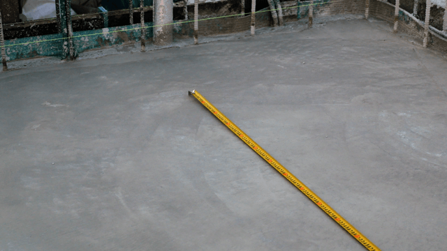 Concrete floor with measuring tape