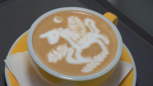 Latte art with a unicorn design in a cup