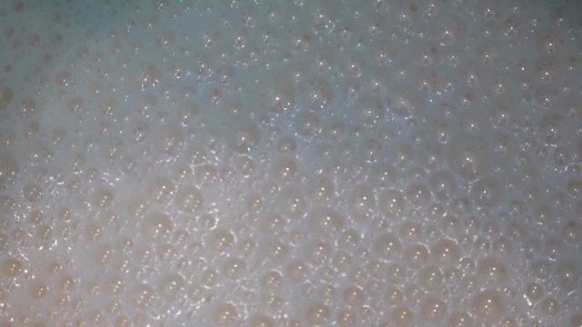 Bubbles forming on boiling liquid