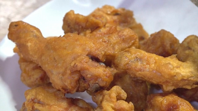 Crispy fried chicken on a white plate