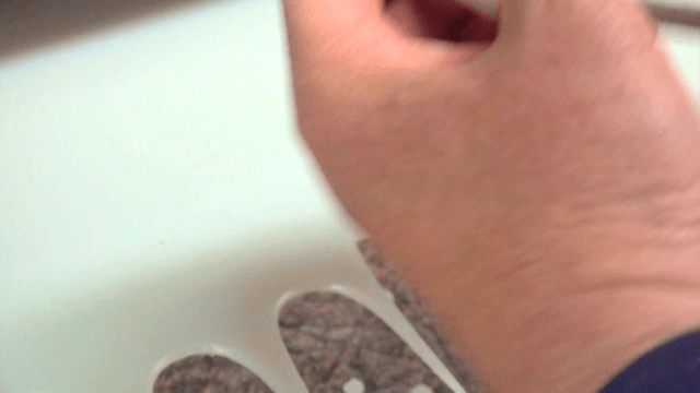 Hands assembling inner fabric of gloves in factory