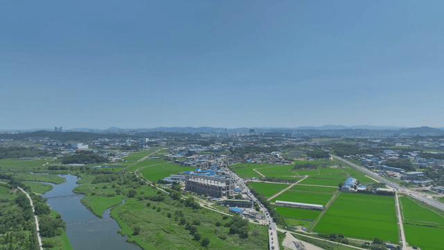 Aerial view of a rural village and fields