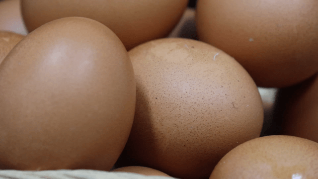 Stacked fresh brown eggs