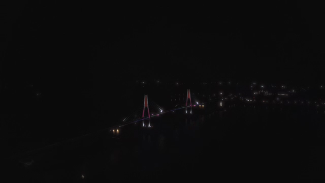 Night view of a bridge with colorful lights