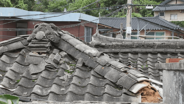 Traditional Korean roof with modern buildings
