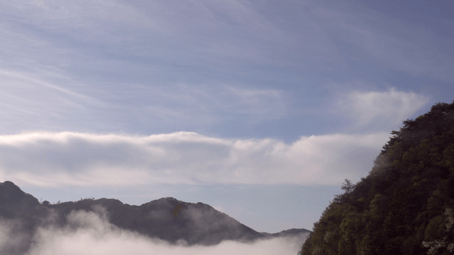 Misty mountains under a clear sky