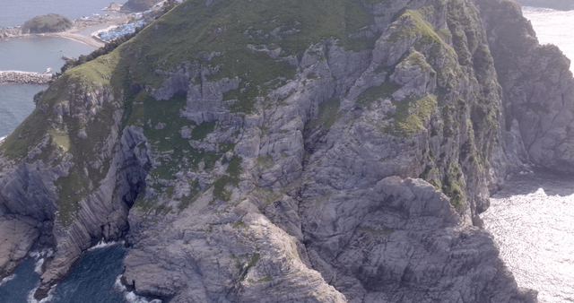 A rocky mountain by the sea