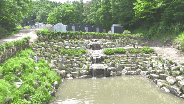 A small waterfall flowing along an artificial waterway