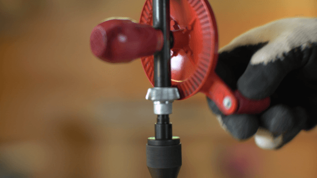Close-up of a hand drill being adjusted