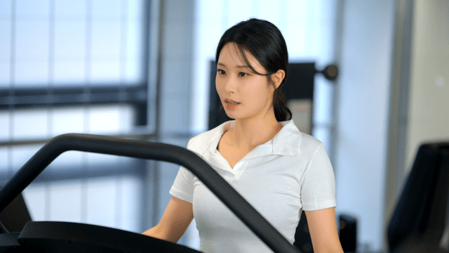 Woman exercising on a treadmill at gym