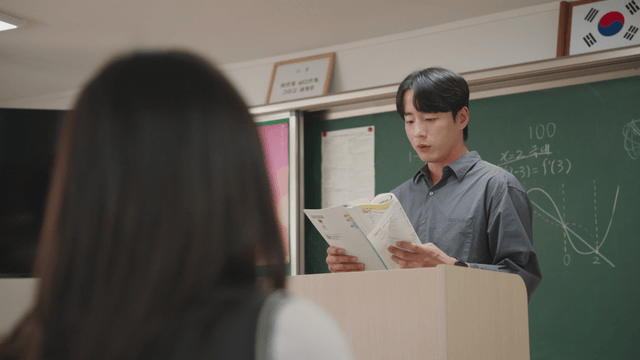 Teacher giving a lecture in a classroom