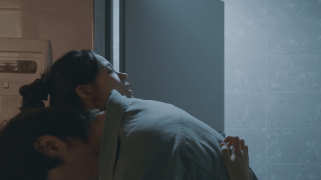 Drunk man hugging woman